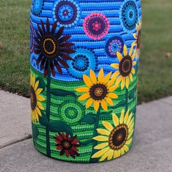 Rain barrel with sunflowers